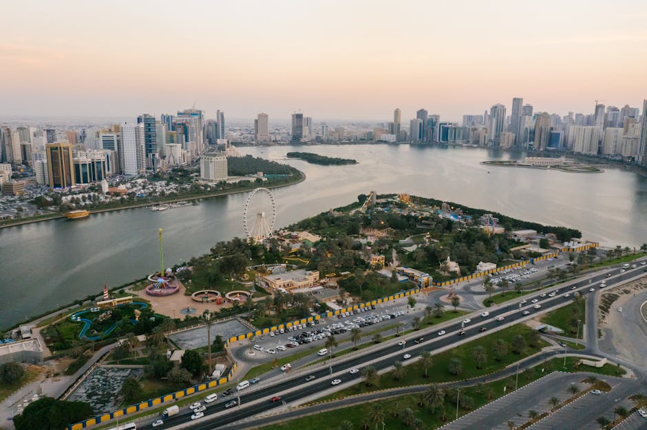 services-01 A stunning aerial shot of Sharjah cityscape featuring parks, landmarks, and coastline at sunset.